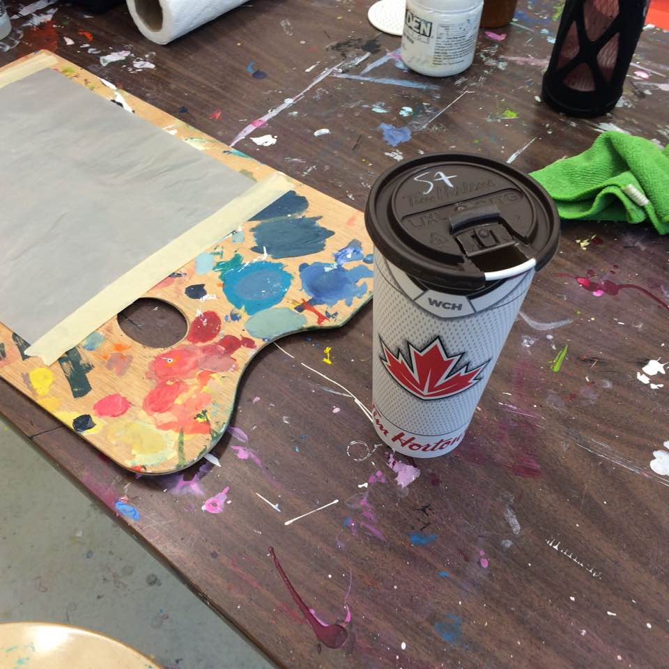 Palette and coffee cup in Anne Reid Artist studio
