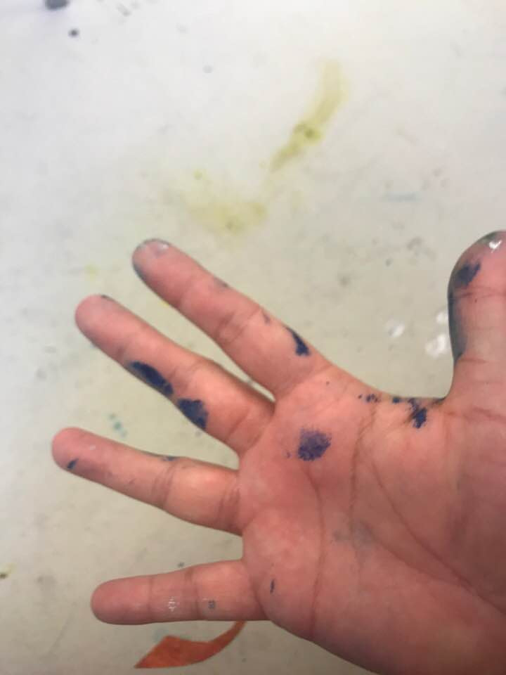 Paint on Anne Reid Artist's hand during studio work