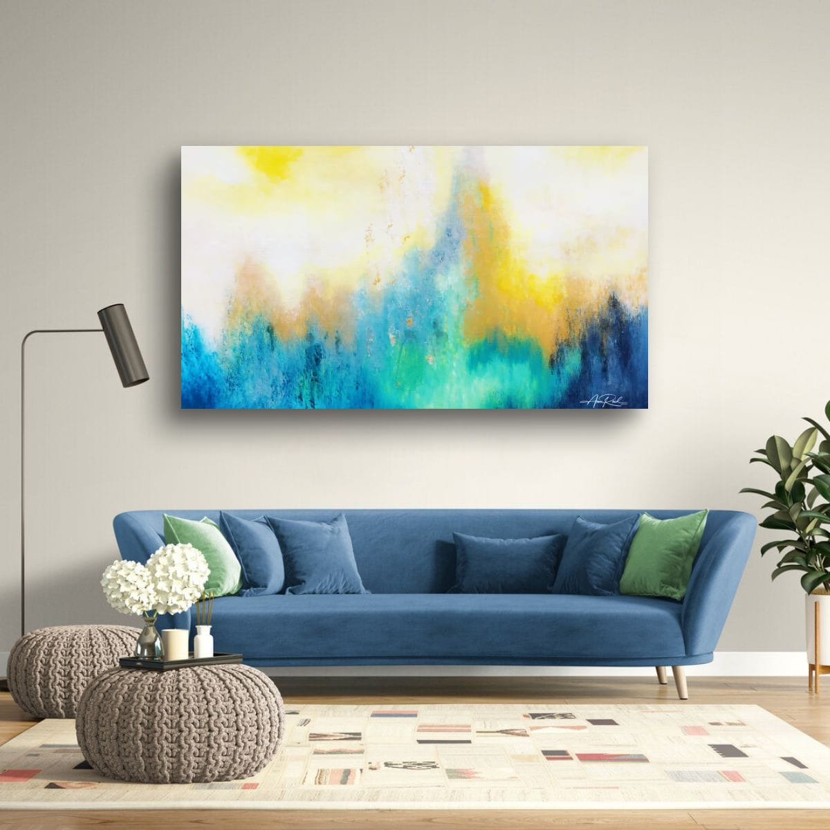 Third Day 3, print shown above a blue sofa in a living room setting.