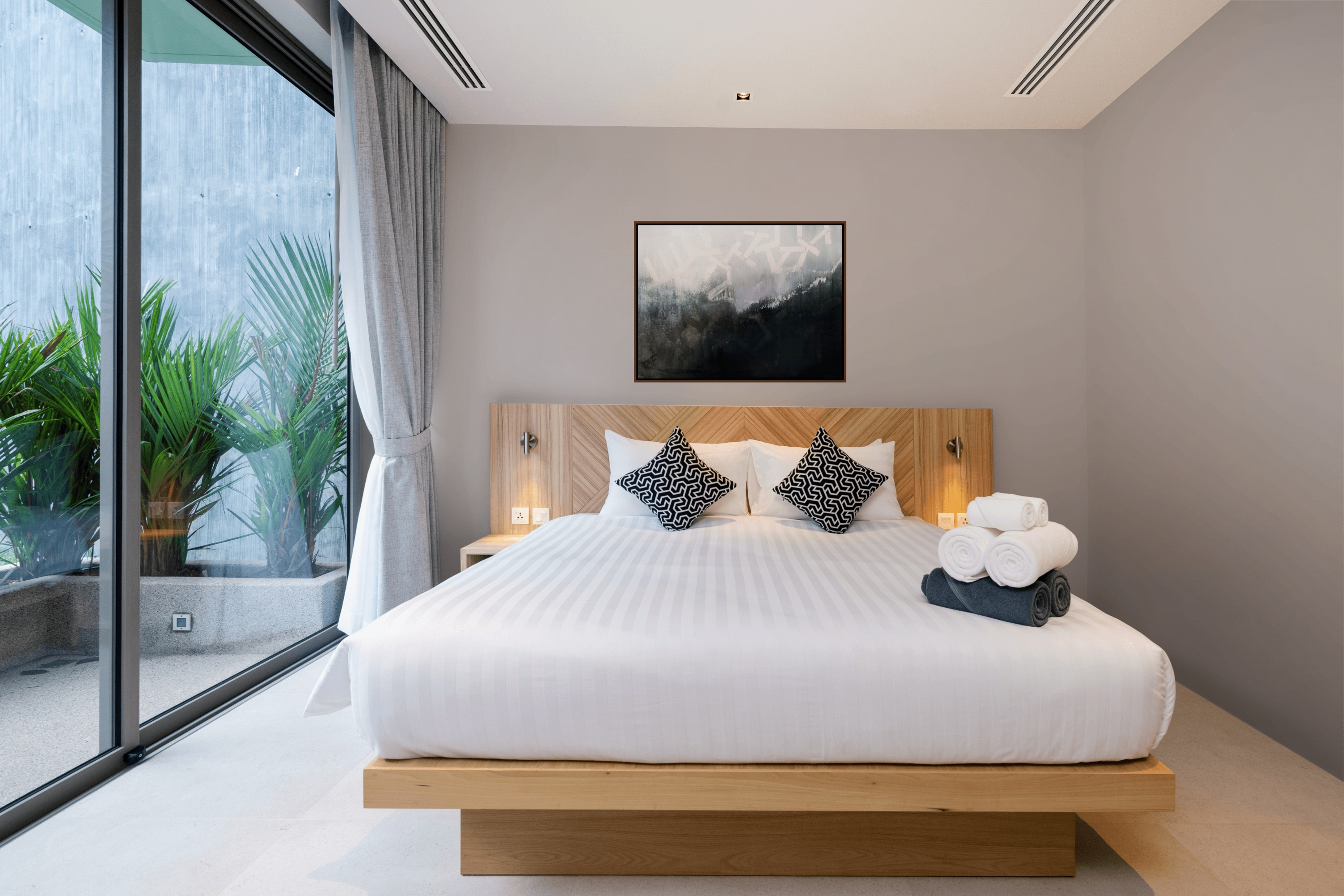 Captivity, print shown in a modern bedroom setting.